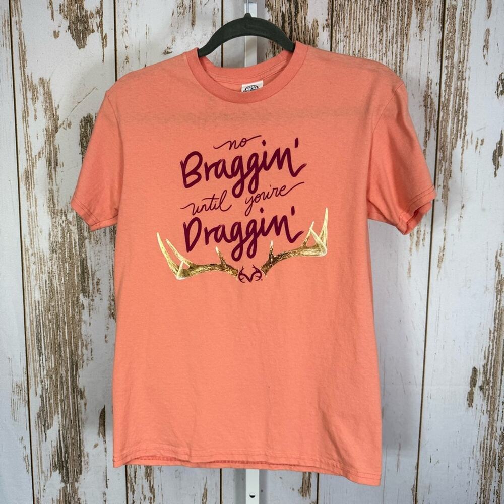 Delta, Coral Tee with Gold and Purple Hunting Graphic. Size Small.
